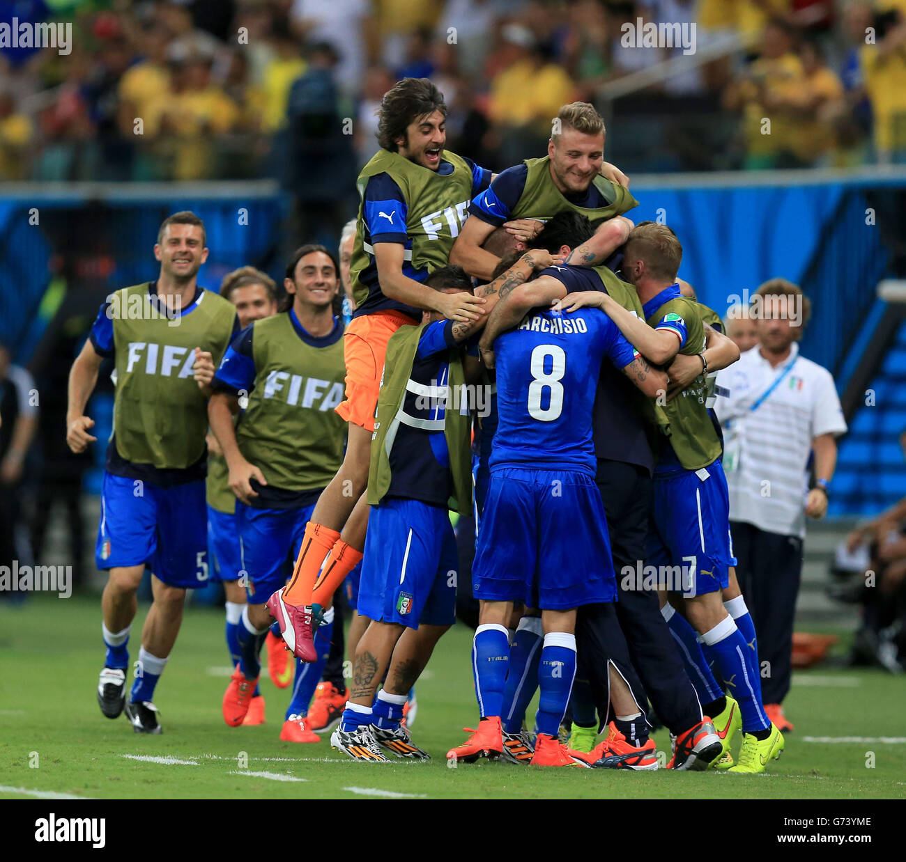 Italy's Claudio Marchisio (no.8) celebrates scoring his side's first goal of the game with team-mates during the FIFA World Cup, Group D match at the Arena da Amazonia, Manaus, Brazil. Stock Photo