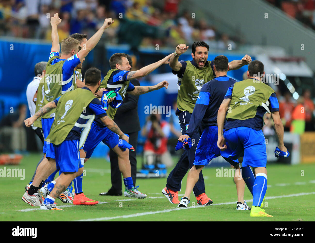 Italy players and substitutes celebrate after the final whistle blows during the FIFA World Cup, Group D match at the Arena da Amazonia, Manaus, Brazil. Stock Photo