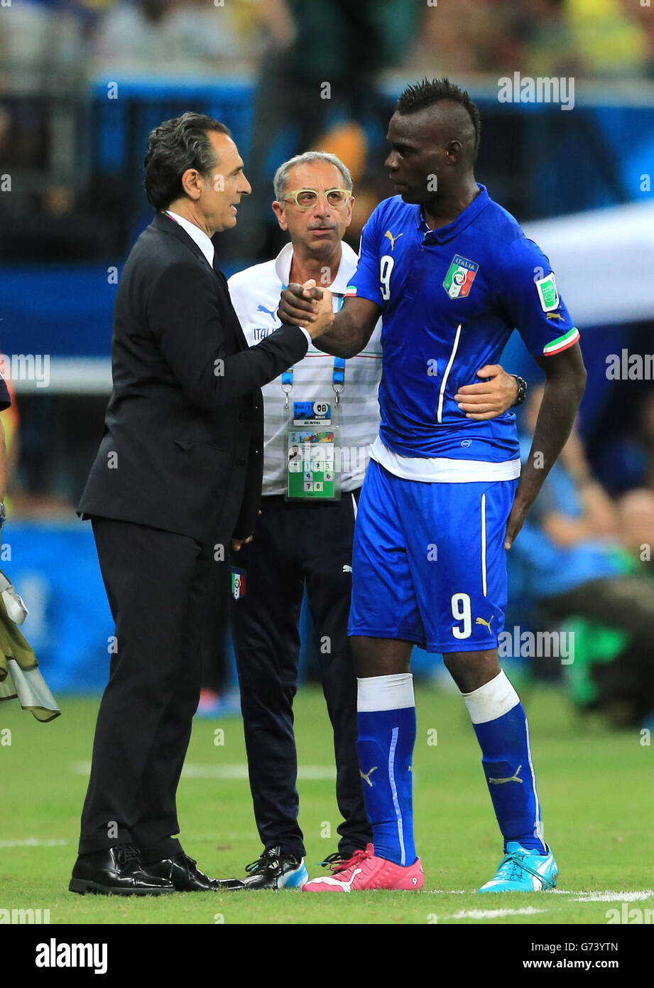 Italy's Mario Balotelli (right) is congratulated by manager Cesare Prandelli (left) during the FIFA World Cup, Group D match at the Arena da Amazonia, Manaus, Brazil. Stock Photo