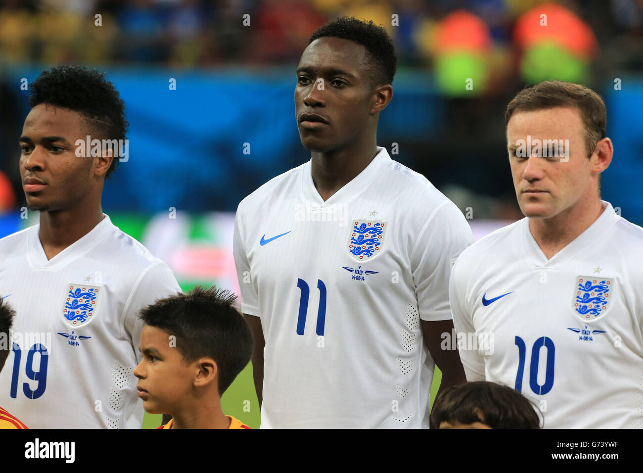 (left to right) England's Raheem Sterling, Danny Welbeck and Wayne Rooney during the line up before the FIFA World Cup, Group D match at the Arena da Amazonia, Manaus, Brazil. PRESS ASSOCIATION Photo. Picture date: Saturday June 14, 2014. See PA story SOCCER England. Photo credit should read: Nick Potts/PA Wire. No commercial use. No use with any unofficial 3rd party logos. No manipulation of images. No video emulation Stock Photo