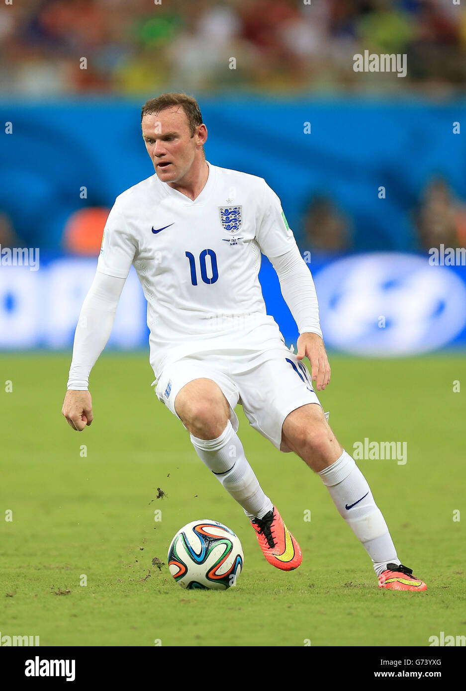 England's Wayne Rooney during the FIFA World Cup, Group D match at the Arena da Amazonia, Manaus, Brazil. PRESS ASSOCIATION Photo. Picture date: Saturday June 14, 2014. See PA story SOCCER England. Photo credit should read: Mike Egerton/PA Wire. Editorial use only. No commercial use. No use with any unofficial 3rd party logos. No manipulation of images. No video emulation Stock Photo