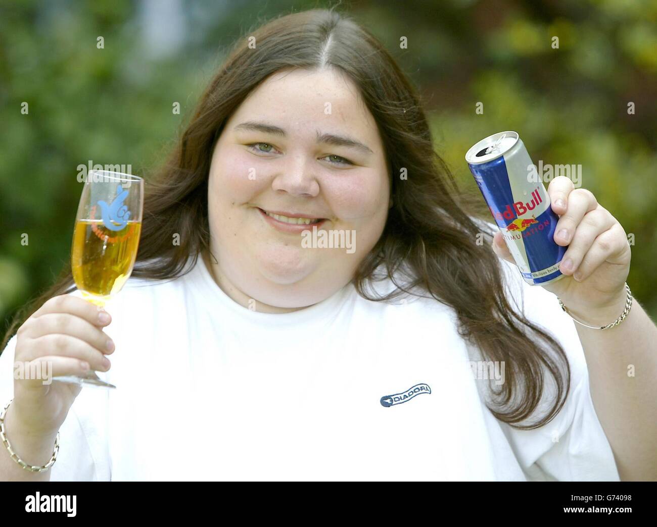 Jubilant Hayley Morrish, 17, celebrates her 1 million Lottery scratch card win with a can of Red Bull at the St David's Park hotel, Chester. The petrol station cashier earning 3.80-an-hour tried her luck on a 5 'Bullion' card during a quiet shift in Tarvin, Cheshire and landed the top prize. She told reporters she intends to buy driving lessons and a Citroen Saxo. Stock Photo