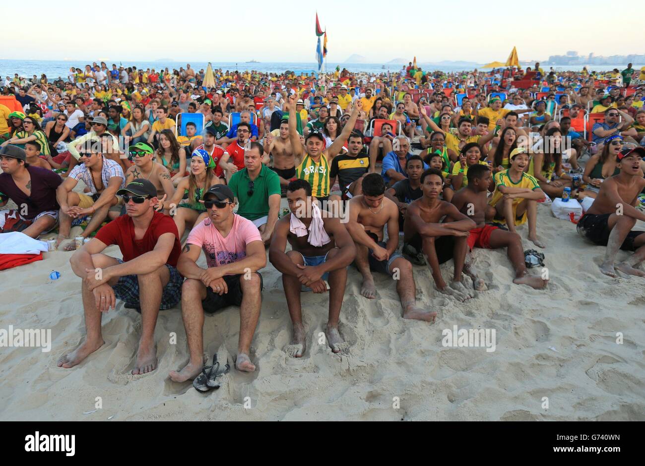 Soccer - FIFA World Cup 2014 - Fan Camp - Copacabana Beach. Brazil Fans watch the Brazil v Mexico match on a big screen on Copacabana Beach, Rio de Janeiro, Brazil. Stock Photo