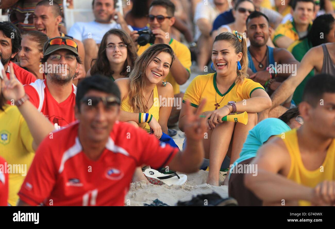 Brazil Fans watch the Brazil v Mexico match on a big screen on Copacabana Beach, Rio de Janeiro, Brazil. Stock Photo