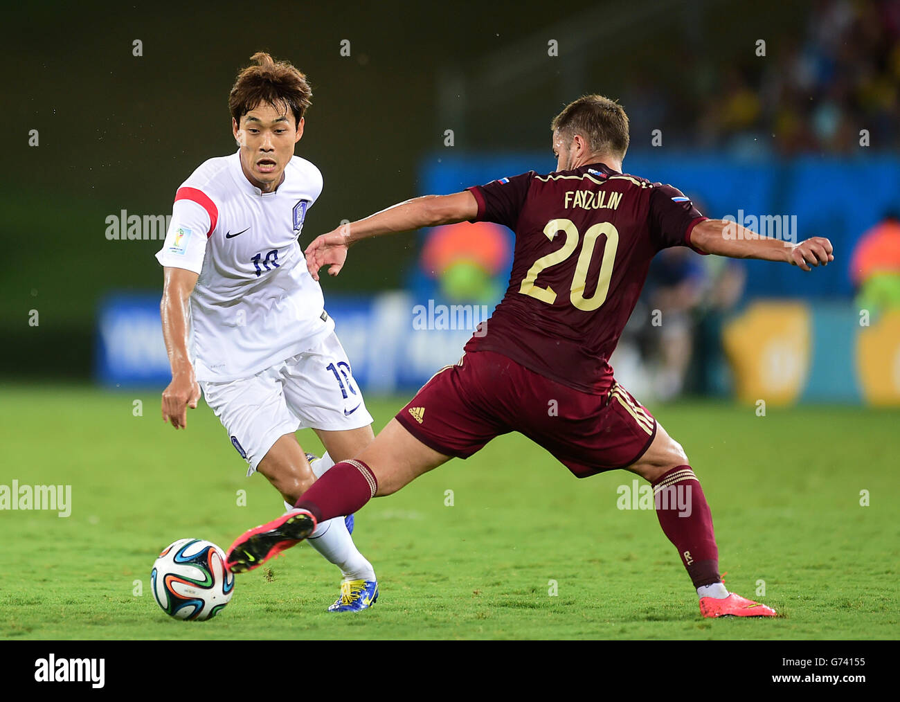 South Korea's Park chu-Young (left) battles for the ball with Russia's Viktor Fayzulin Stock Photo