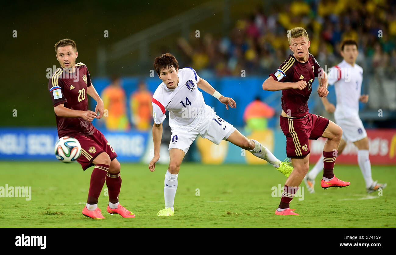 South Korea's Han Kook-Young (centre) battles for the ball with Russia's Viktor Fayzulin (left) and Oleg Shatov Stock Photo