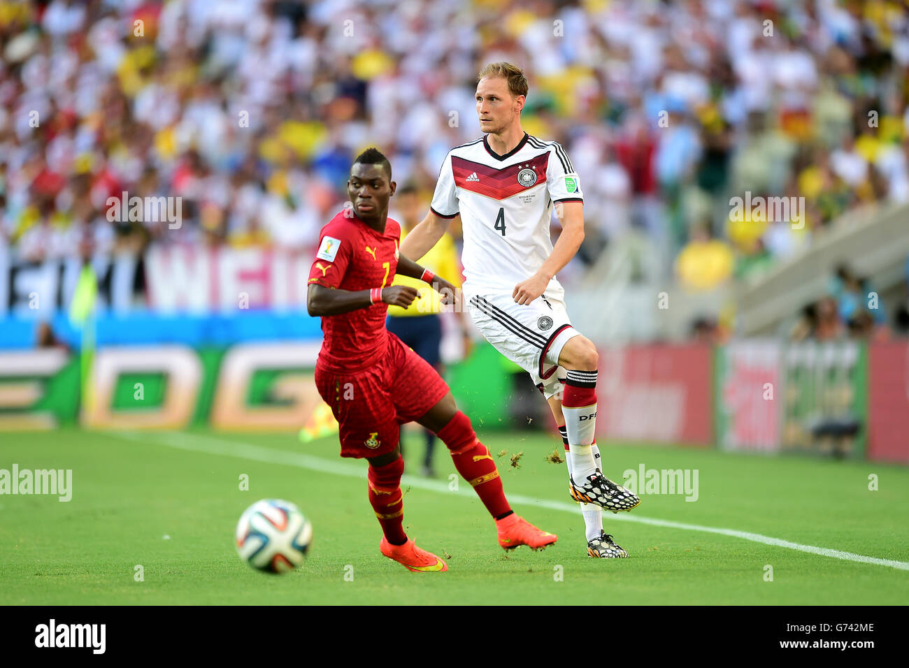 Soccer - FIFA World Cup 2014 - Group G - Germany v Ghana - Estadio Castelao. Germany's Benedikt Howedes (right) and Ghana's Christian Atsu battle for the ball Stock Photo