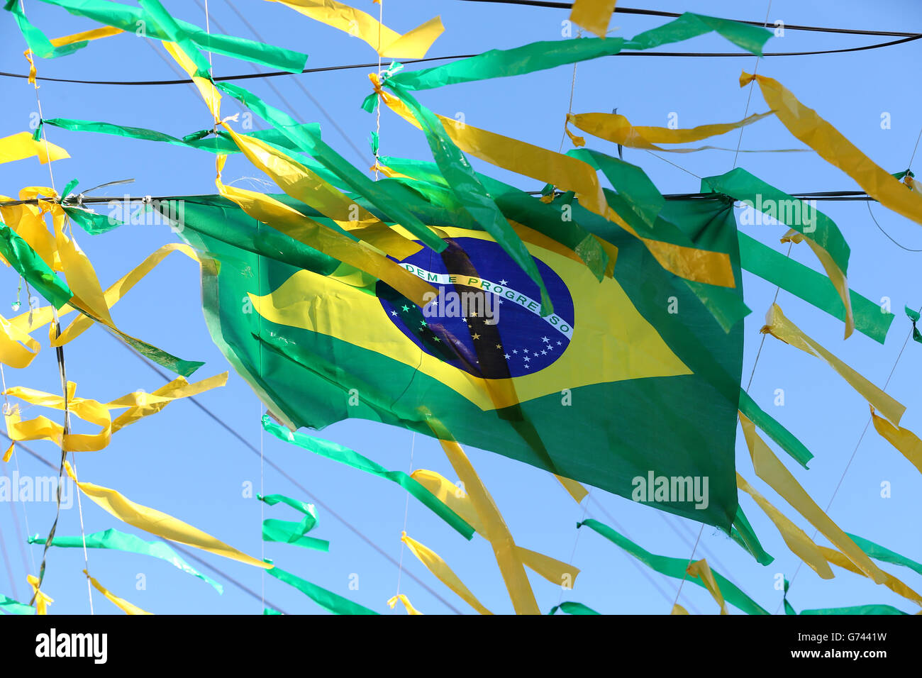 A Brazilian national flag above the streets of Manaus before the FIFA World Cup, Group D match at the Arena da Amazonia, Manaus, Brazil. Stock Photo