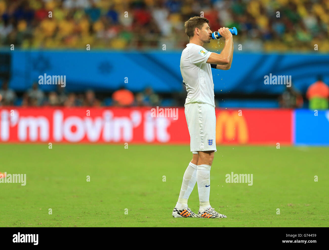 England's Steven Gerrard takes a drink of water during the match Stock Photo