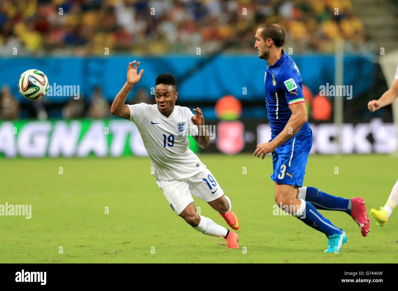 England's Raheem Sterling (left) in action with Italy's Giorgio Chiellini Stock Photo