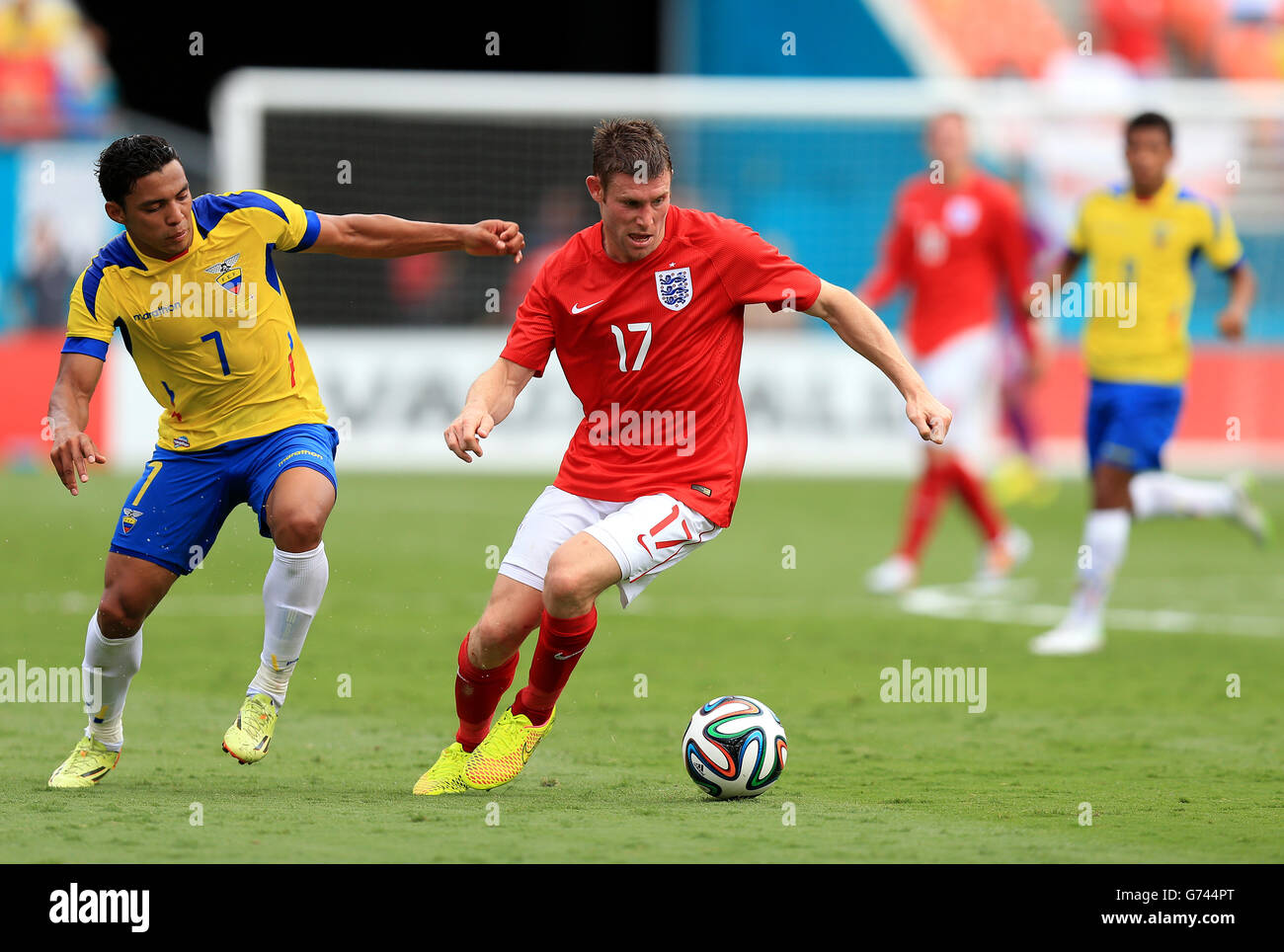 England's James Milner (right) comes under pressure from Ecuador's Jefferson Montero Stock Photo
