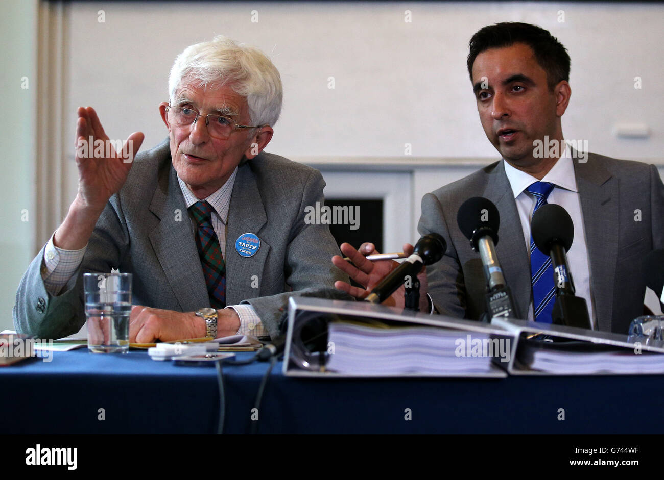 Dr Jim Swire (left), the father of Flora Swire who died in the bombing of Pan Am Flight 103 over Lockerbie in 1988, with solicitor Aamer Anwa (right) during a press conference at the Royal Faculty of Procurators in Glasgow as relatives of Abdelbaset al-Megrahi, the only man convicted of the Lockerbie bombing, are to pursue a fresh bid to clear his name more than two years after his death. Stock Photo