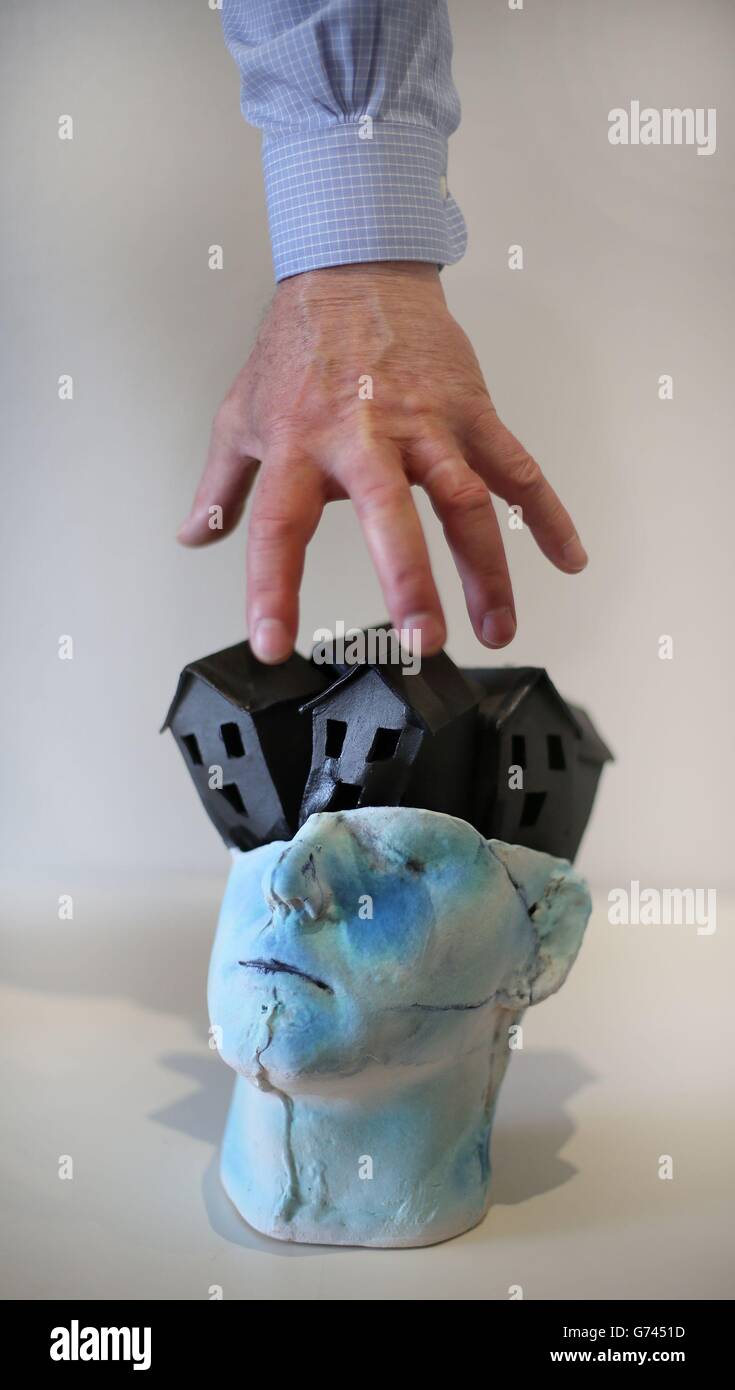 A sculpture entitled Sighs of the Times by Eleanor Swan which is displayed in the Open Window Gallery in Dublin, as the Irish Central Bank revealed 132,217 household mortgages are in arrears. Stock Photo