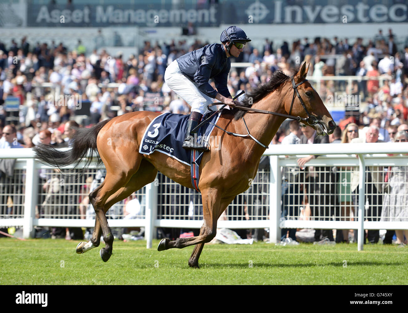 Dazzling ridden by jockey Seamie Heffernan before the Investec Oaks (In Memory Of Sir Henry Cecil) during Investec Ladies Day at Epsom Downs Racecourse, Surrey. Stock Photo
