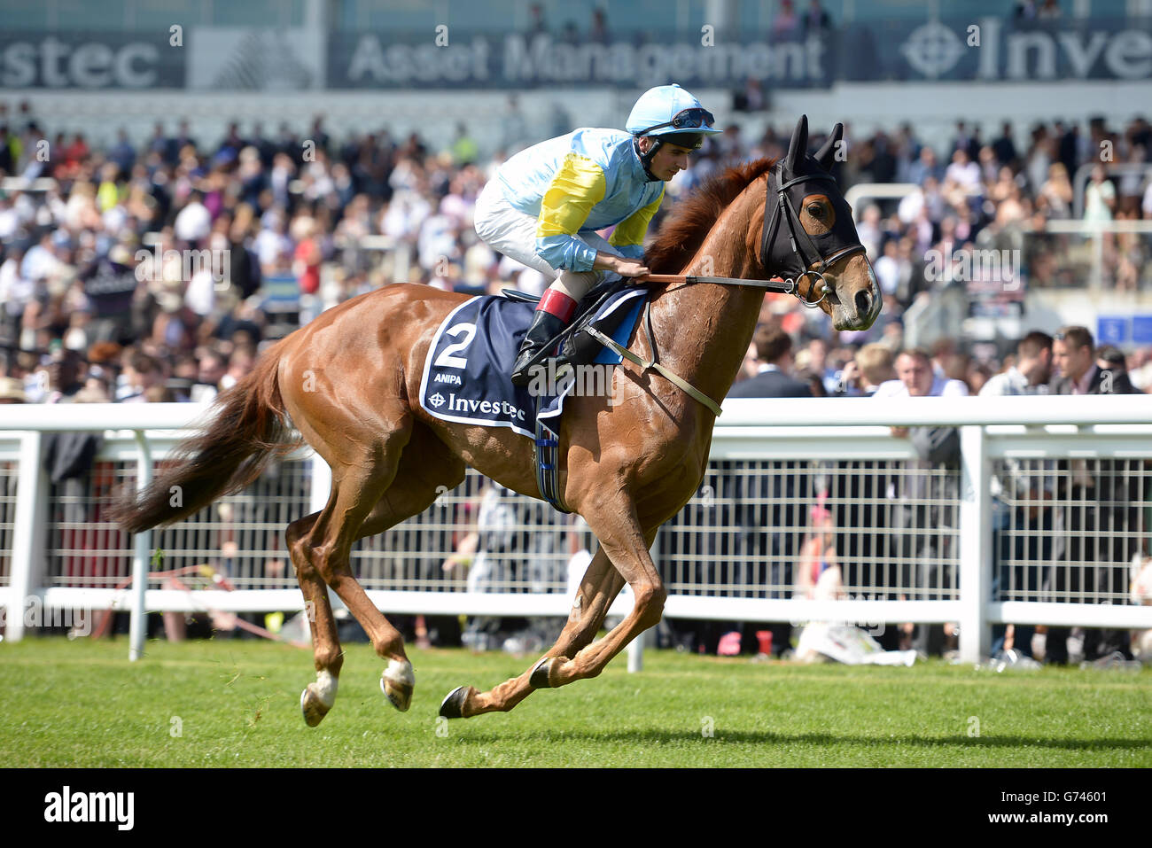 Anipa ridden by jockey Andrea Atzeni before the Investec Oaks (In Memory Of Sir Henry Cecil) during Investec Ladies Day at Epsom Downs Racecourse, Surrey. Stock Photo