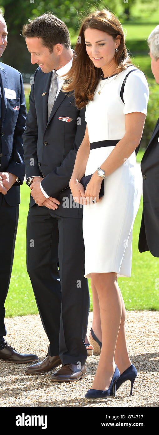 The Duchess of Cambridge with Olympic Gold Medalist Sir Ben Ainslie as she arrives at the National Maritime Museum, London, to meet supporters of the bid to launch a British team to take part in sailing competition the America's Cup. Stock Photo