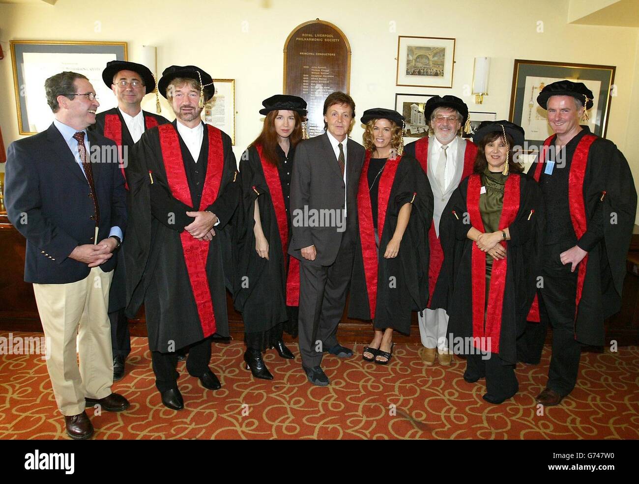 Sir Paul McCartney with two members of the band The Bangles, Vicki Peterson (right) and Michael Steele, with (left-right in gowns) Ken Campbell, Tim Firth, Terry Marshall, Arlene Phillips, Willy Russell and Jon Webster, who where made companions of the Liverpool Institute for Performing Arts during a ceremony, at The Liverpool Philharmonic Hall, for thier contribution to arts and entertainment and for sharing expertise with LIPA students. Stock Photo