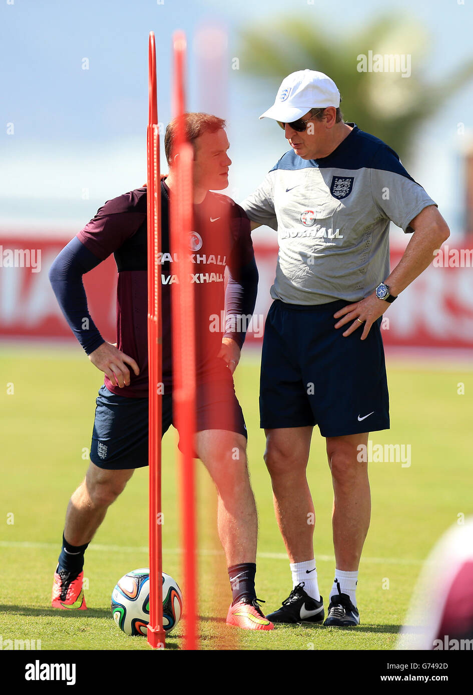 Soccer - FIFA World Cup 2014 - Group D - Uruguay v England - England Training and Press Conference - Urca Military Training G.... England manager Roy Hodgson with Wayne Rooney during a training session at the Urca Military Training Ground, Rio de Janeiro, Brazil. Stock Photo