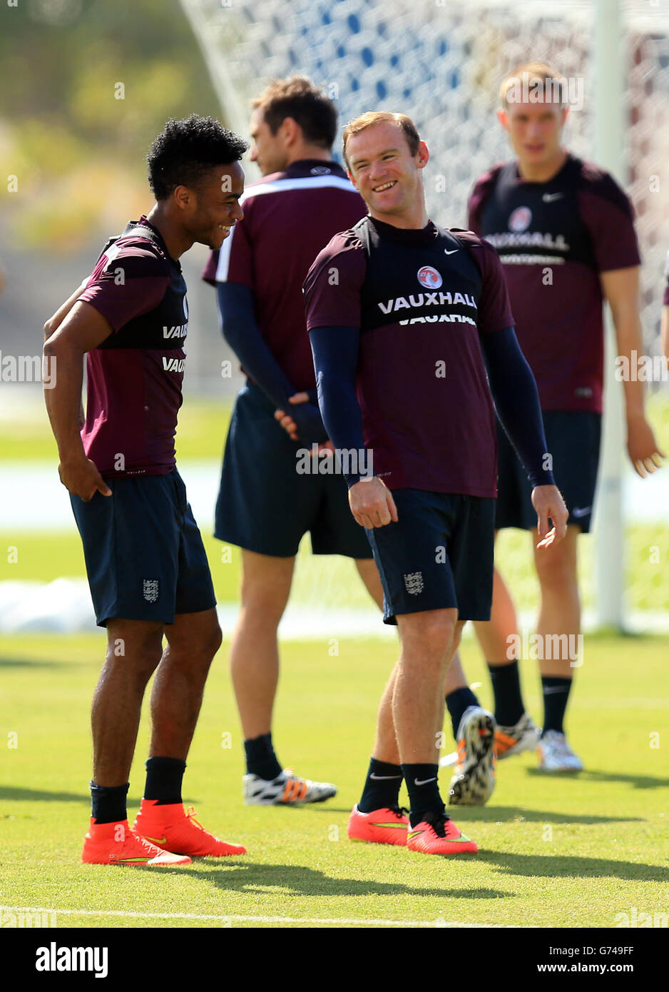 Soccer - FIFA World Cup 2014 - Group D - Uruguay v England - England Training and Press Conference - Urca Military Training G.... England's Wayne Rooney and Raheem Stirlng during a training session at the Urca Military Training Ground, Rio de Janeiro, Brazil. Stock Photo