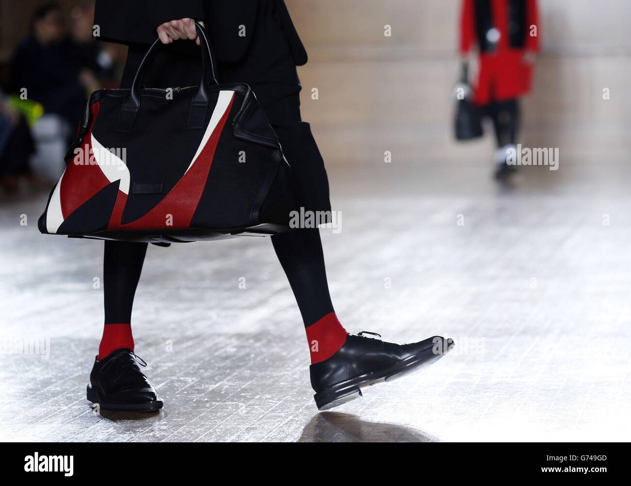 Models appear on the catwalk during the Alexander McQueen show on day two of London Collections Men at the Royal College of Surgeons, London. Stock Photo