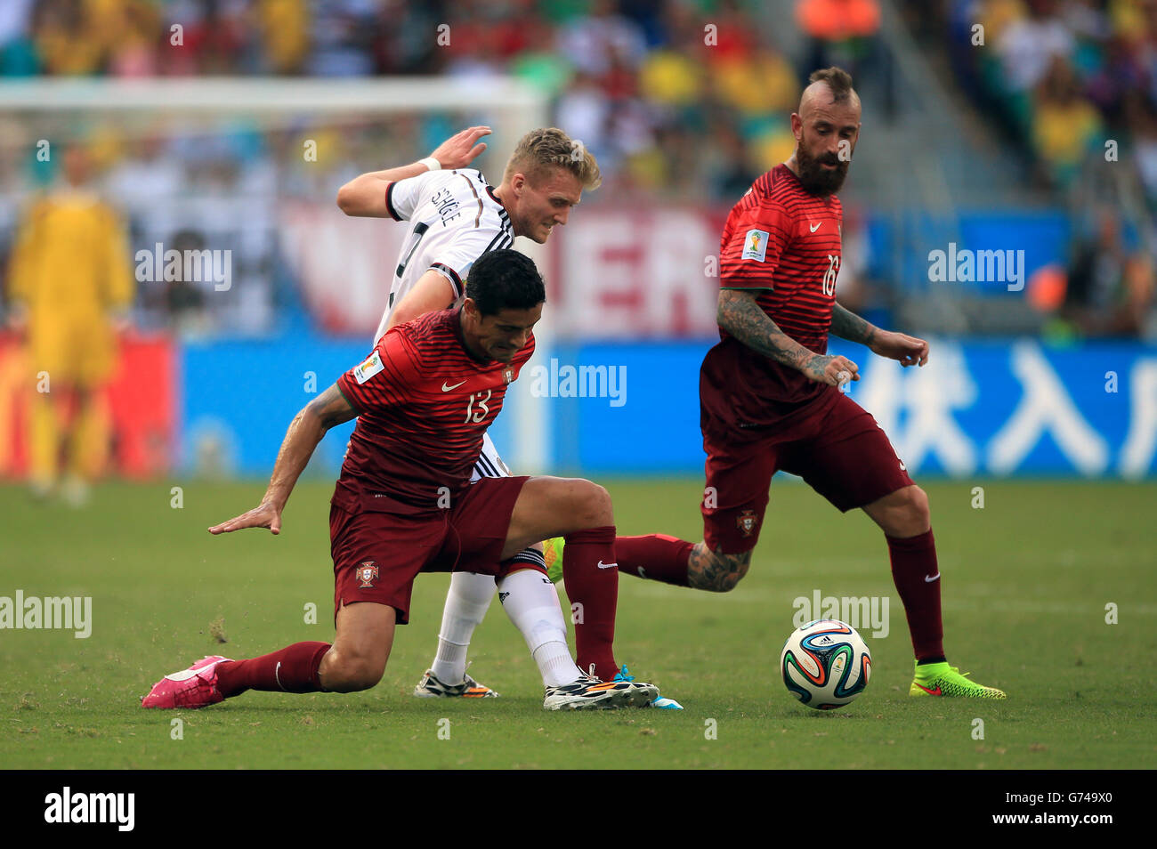 Soccer - FIFA World Cup 2014 - Group G - Germany v Portugal - Arena Fonte Nova. Germany's Andre Schurrle and Portugal's Ricardo Costa (left) Stock Photo