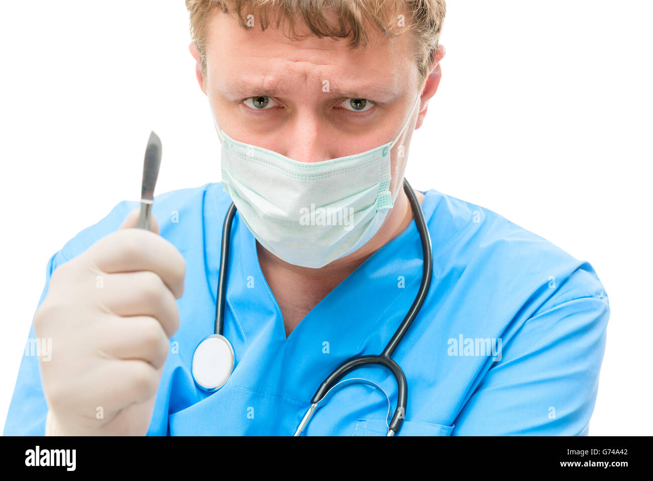 evil and crazy surgeon in the mask on a white background Stock Photo