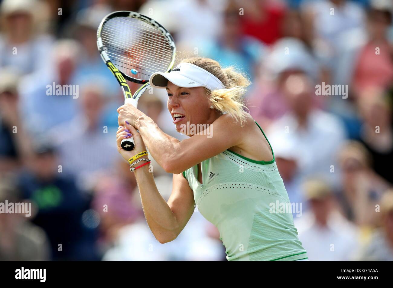 Caroline wozniacki returns to camila giorgi hi-res stock photography