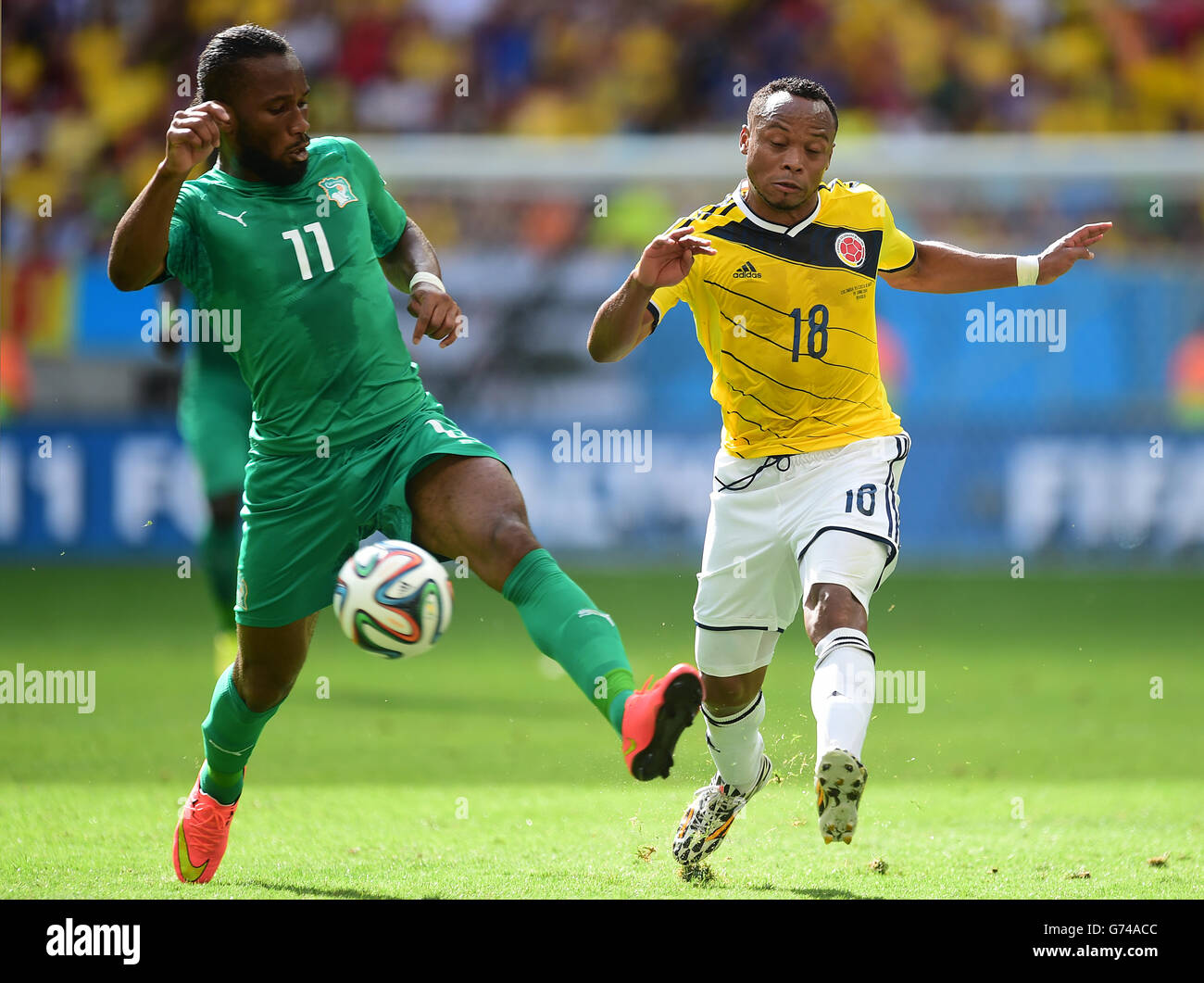 Ivory Coast's Didier Drogba battles for the ball with Colombia's Juan Camilo Zuniga Stock Photo