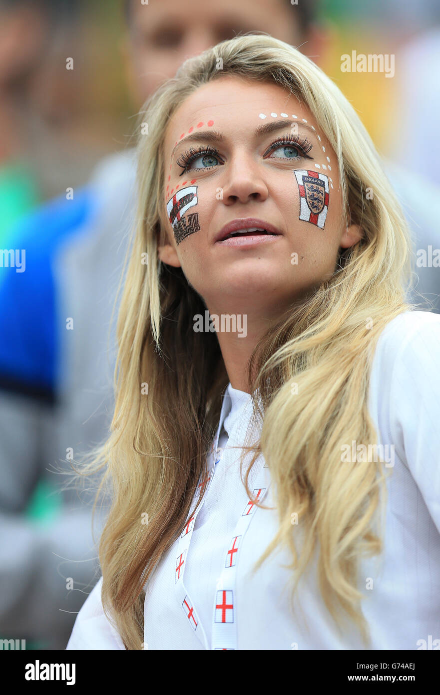 An England fan wearing face paint before the game during the Group D match the Estadio do Sao Paulo, Sao Paulo, Brazil. Stock Photo