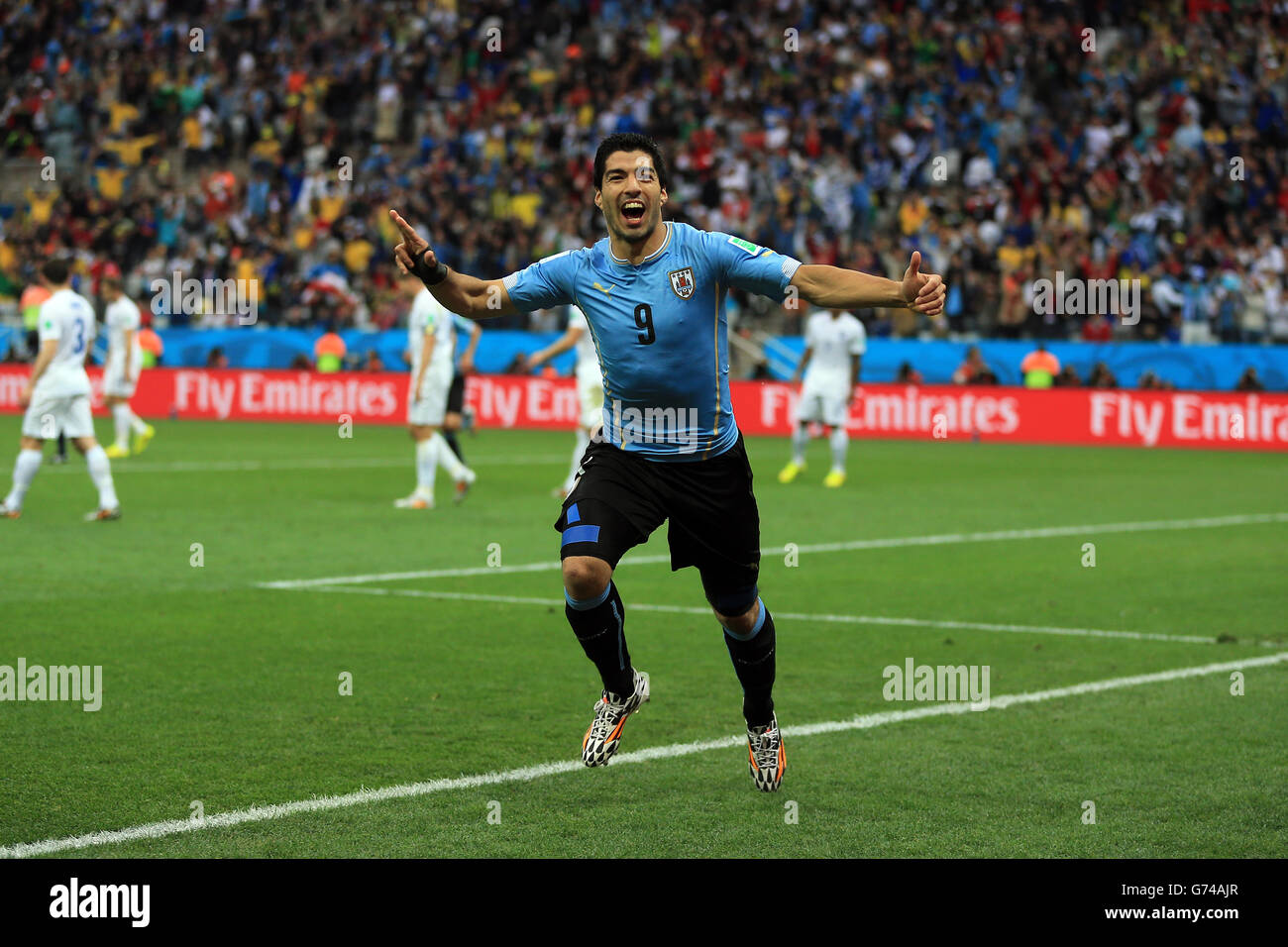 Uruguay's Luis Suarez celebrates scoring the opening goal during the Group D match the Estadio do Sao Paulo, Sao Paulo, Brazil. Stock Photo
