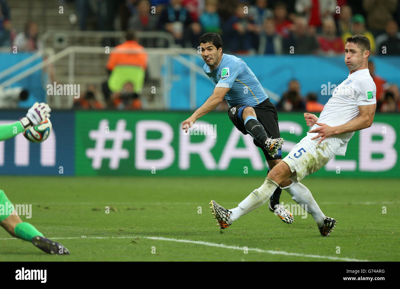 Uruguay's Luis Suarez scores his side's second goal during the Group D match the Estadio do Sao Paulo, Sao Paulo, Brazil. Stock Photo