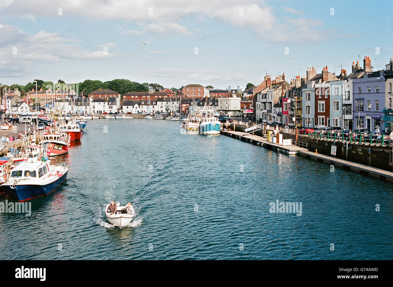 Weymouth harbour on the Dorset coast, Southern England, with trawlers and other boats Stock Photo