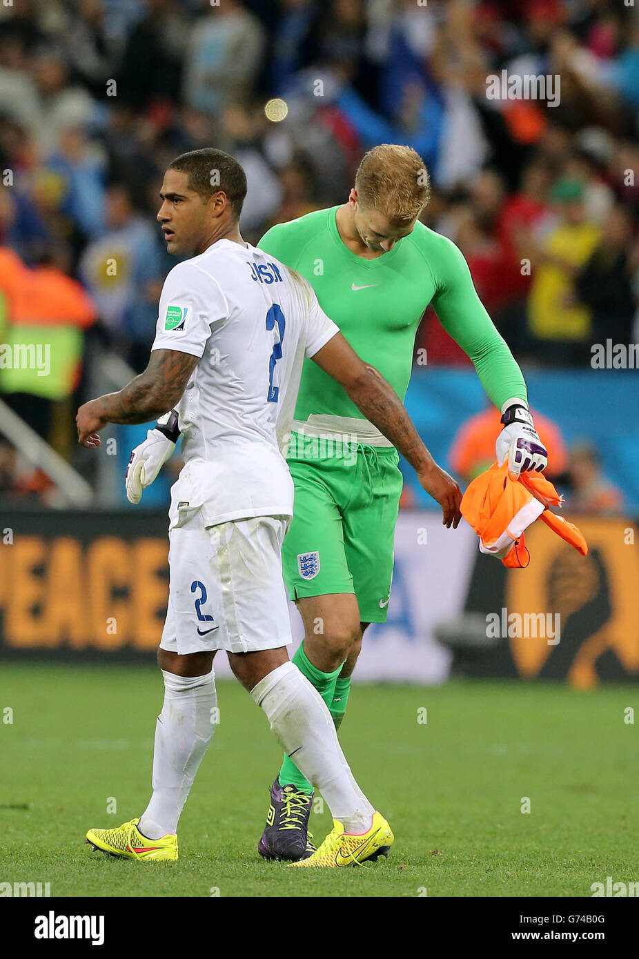 England's Glen Johnson and Joe Hart (right) are left dejected after the final whistle during the Group D match the Estadio do Sao Paulo, Sao Paulo, Brazil. Stock Photo