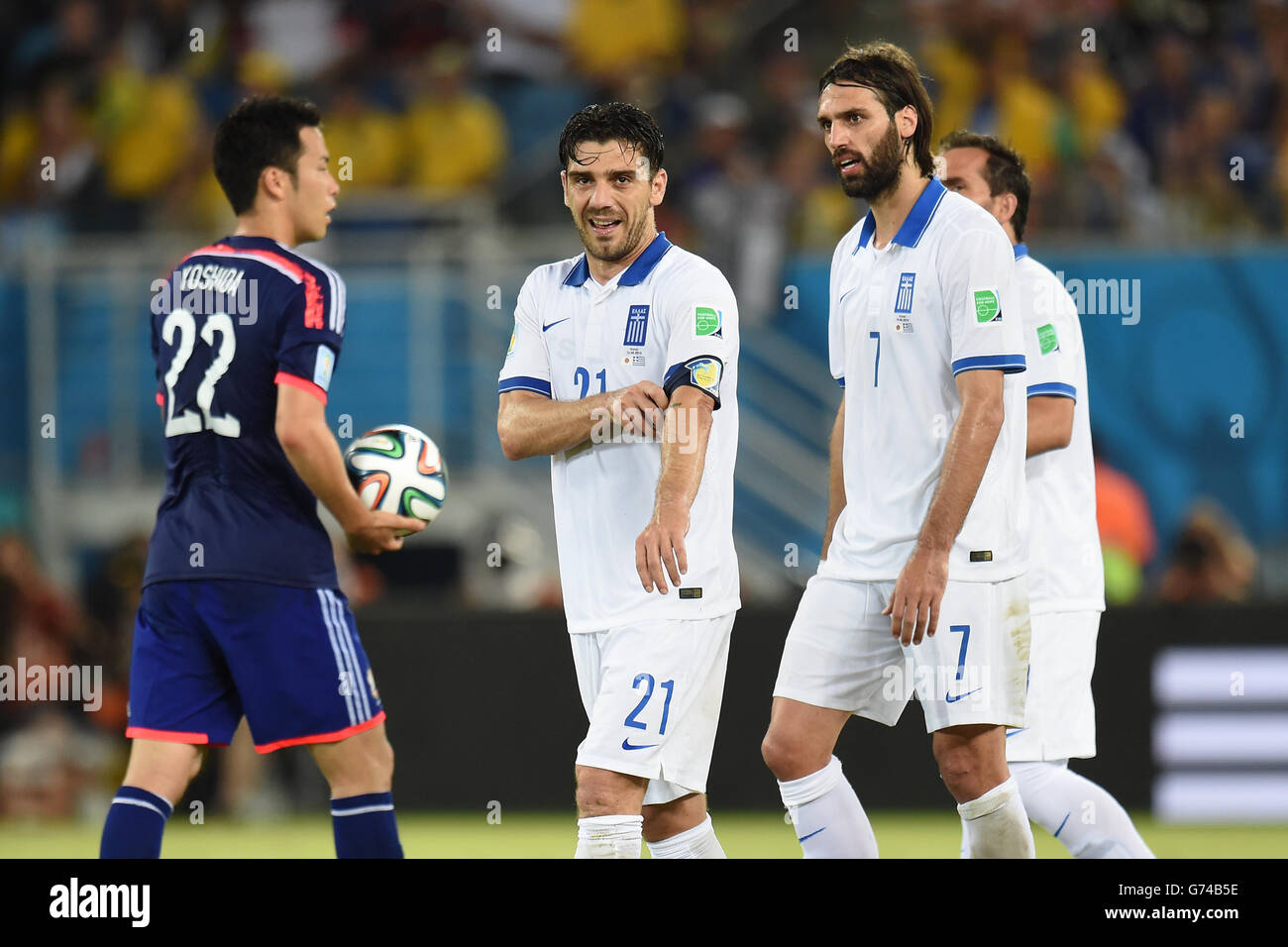 Greece's Konstantinos Katsouranis (centre) walks off after being sent off by match referee Joel Aguilar (not pictured) Stock Photo