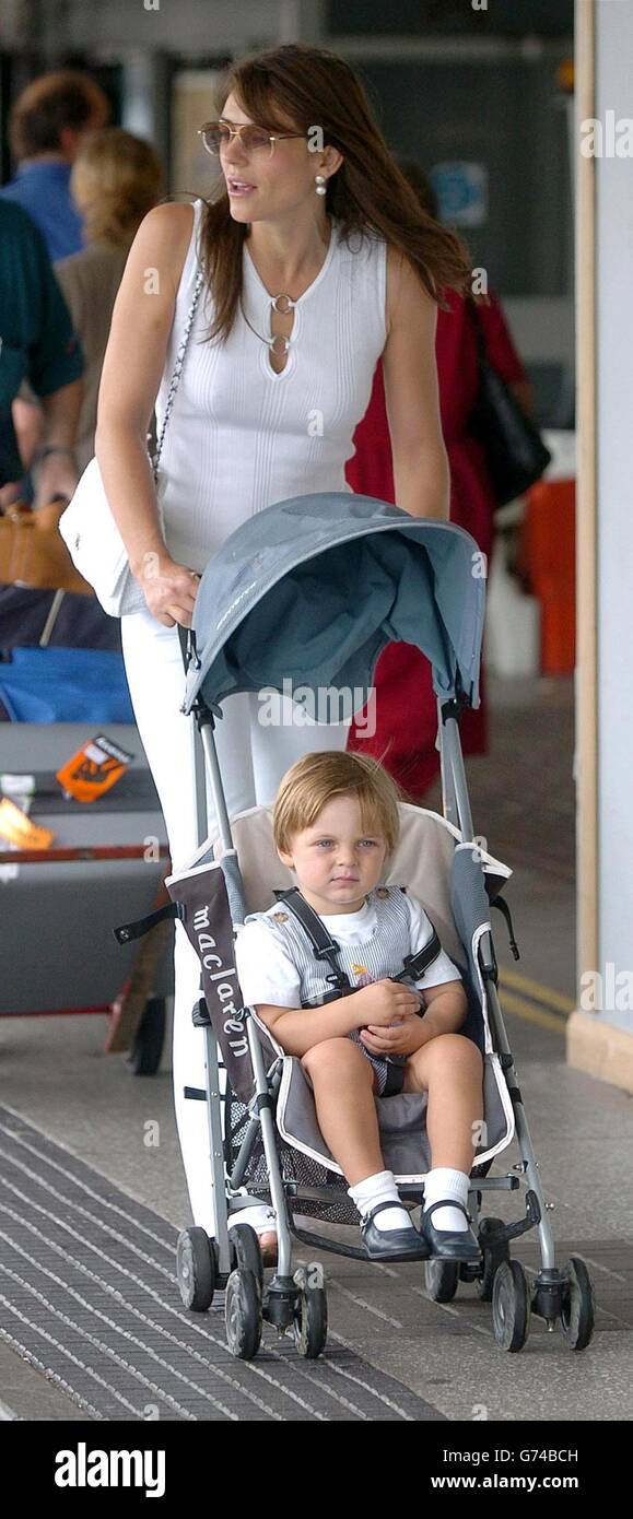 Actress Liz Hurley with her son Damon leaves the UK for the South of France at Heathrow. Stock Photo
