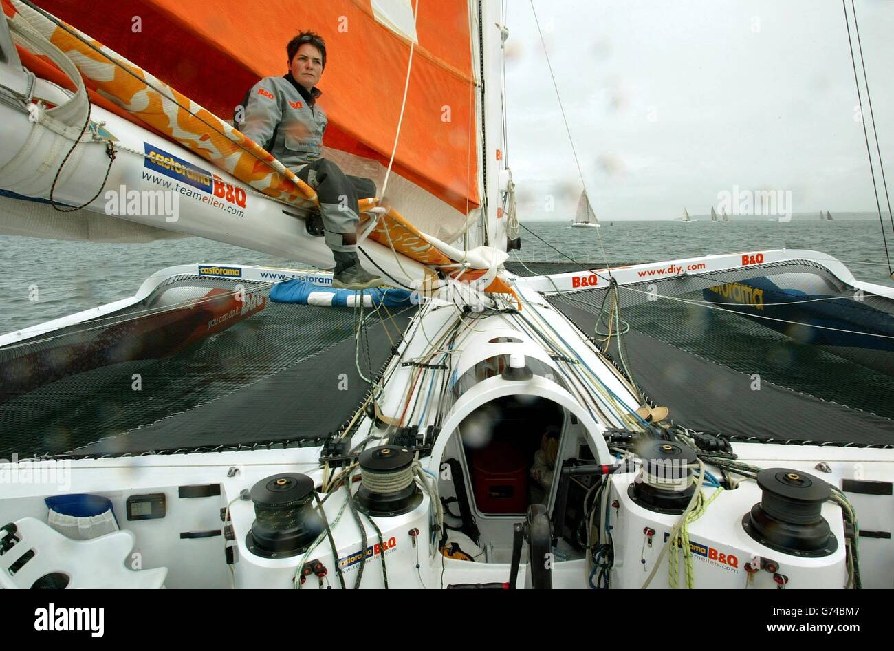 British yachtswoman Ellen MacArthur sits on the mast boom as the auto