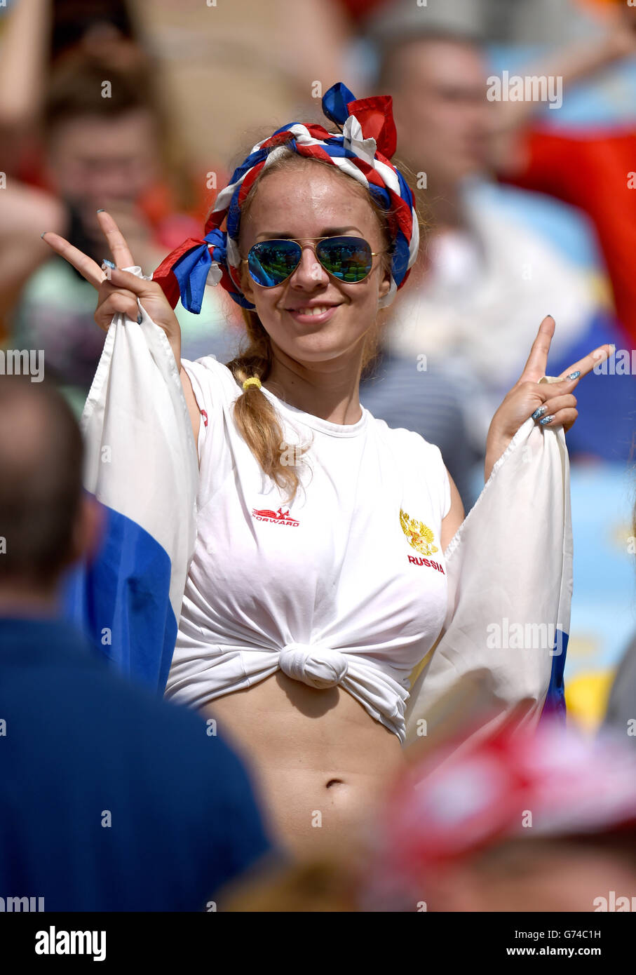 A Russia fan shows support for her team in the stands Stock Photo