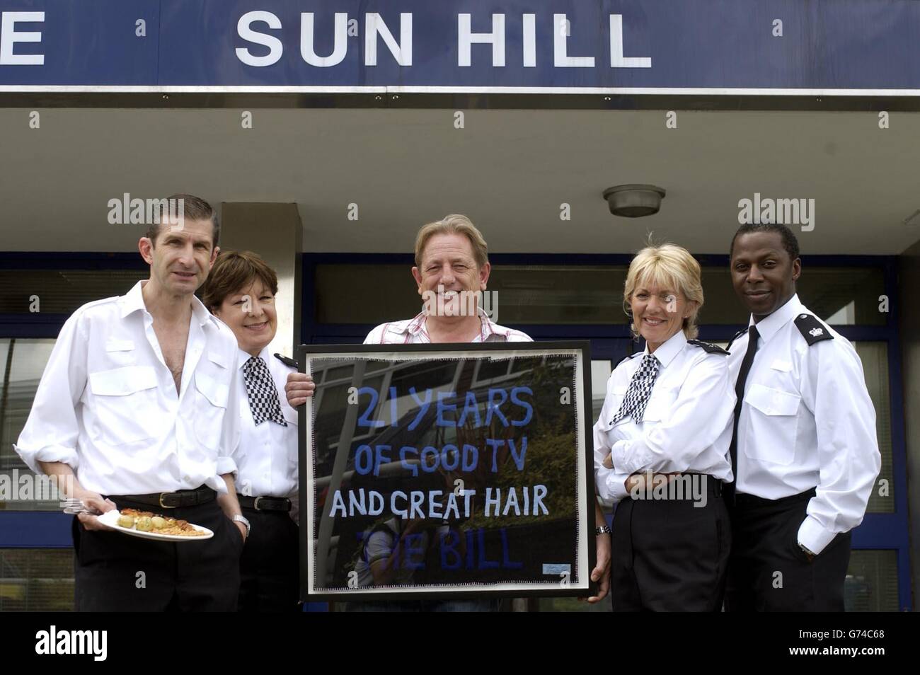 The Bill actors, from left to right; Jeff Stewart, Roberta Taylor, Mark Wingett, Trudie Goodwin and Cyril Nri pose with an artwork given to the ITV show by artist Tracey Emin to celebrate the police drama's 21st anniversary at their studio in south London. Stock Photo
