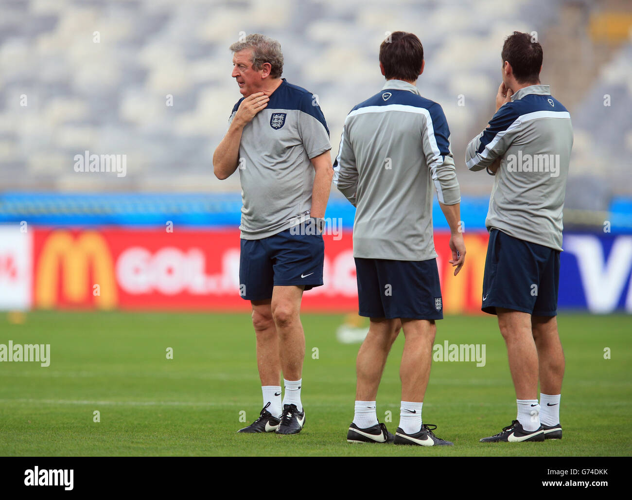 Soccer - FIFA World Cup 2014 - Group D - Costa Rica v England - Day Three - England Training and Press Conference - Estadio M.... England manager Roy Hodgson chats with Gary Neville (center) during a training session at the Estadio Mineirao, Belo Horizonte, Brazil. Stock Photo