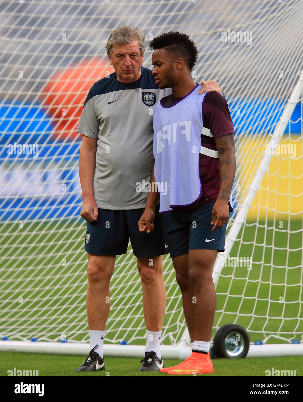 Soccer - FIFA World Cup 2014 - Group D - Costa Rica v England - Day Three - England Training and Press Conference - Estadio M.... England manager Roy Hodgoson chats Raheem Stirling during a training session at the Estadio Mineirao, Belo Horizonte, Brazil. Stock Photo