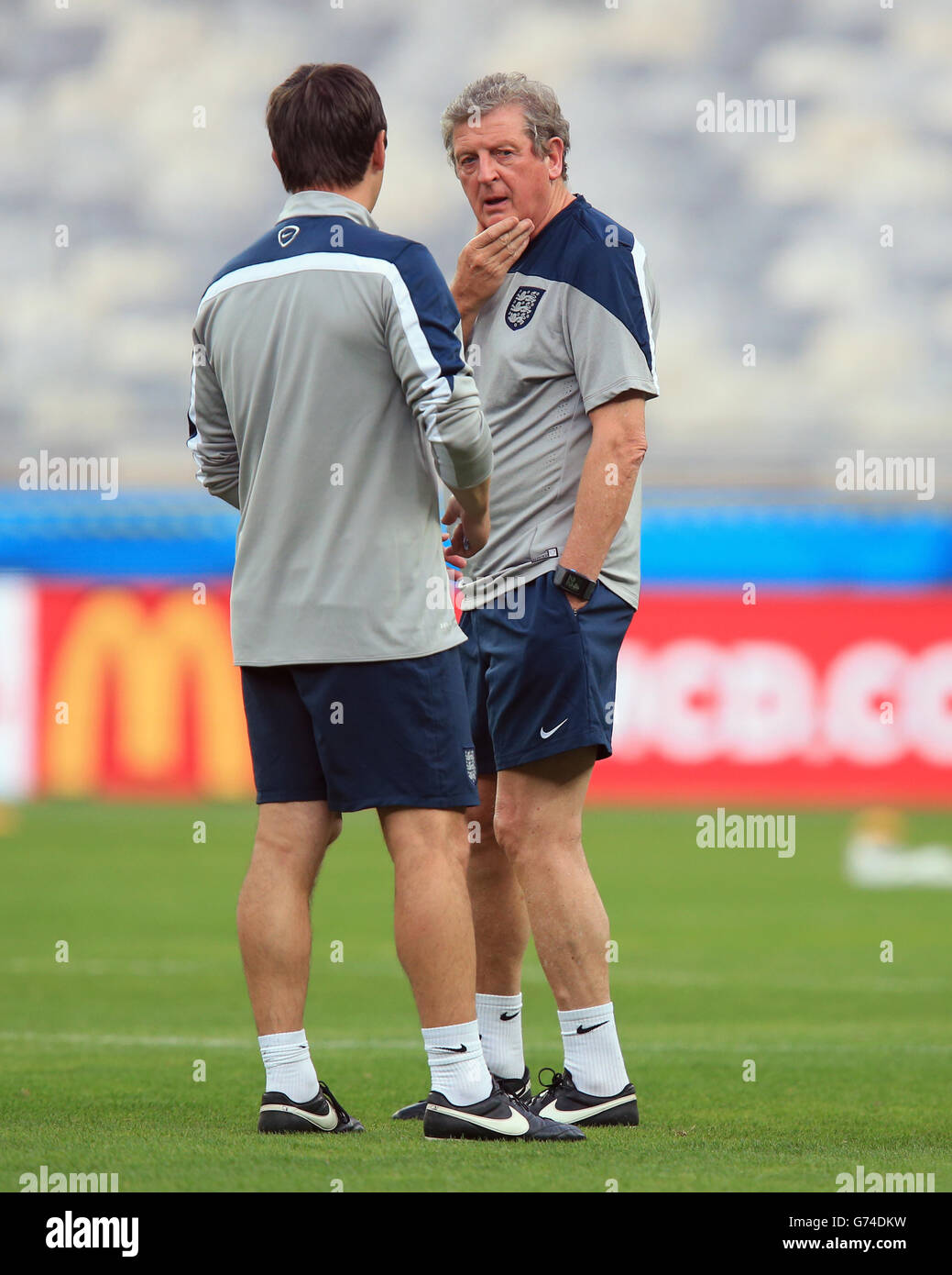 Soccer - FIFA World Cup 2014 - Group D - Costa Rica v England - Day Three - England Training and Press Conference - Estadio M.... England manager Roy Hodgson chats with Gary Neville during a training session at the Estadio Mineirao, Belo Horizonte, Brazil. Stock Photo