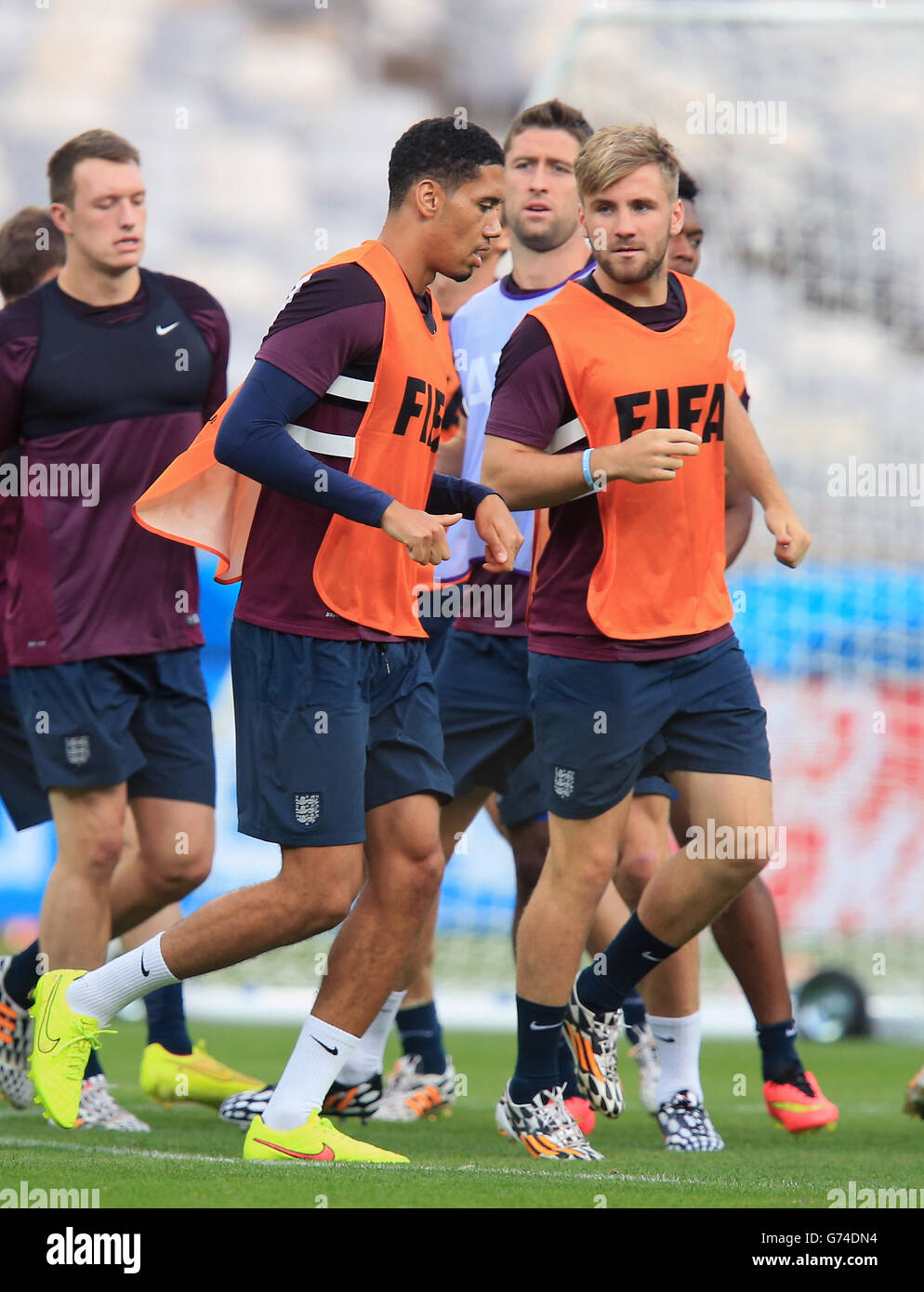 Soccer - FIFA World Cup 2014 - Group D - Costa Rica v England - Day Three - England Training and Press Conference - Estadio M.... England's Luke Shaw chats with Chris Smalling during a training session at the Estadio Mineirao, Belo Horizonte, Brazil. Stock Photo
