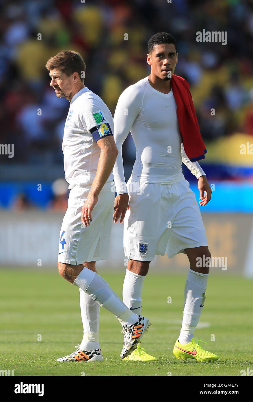 England's Chris Smalling (right) and Steven Gerrard look dejected after the final whistle during the FIFA World Cup, Group D match at the Estadio Mineirao, Belo Horizonte, Brazil. Stock Photo