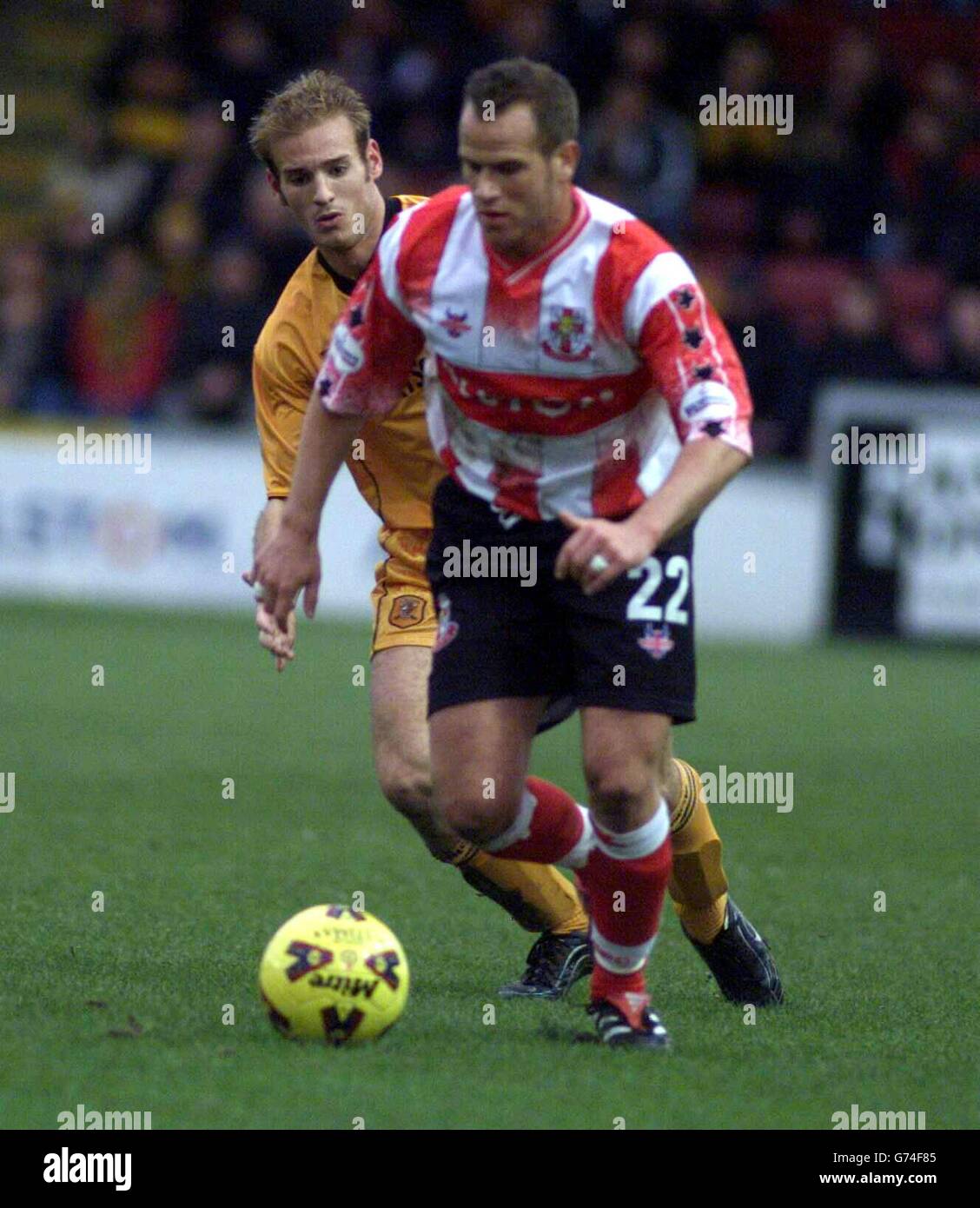 Hull City's Lawrie Dudfield gives chase to Mark Bailey (right) of Lincoln City during the Nationwide Division Three match at Sincil Bank, Lincoln. NO UNOFFICIAL CLUB WEBSITE USE. Stock Photo