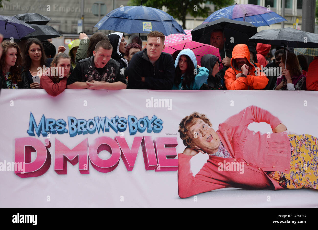 Fans wait in the rain at the world premiere of Mrs Brown's Boys D'Movie at the Savoy Cinema in O'Connell Street, Dublin. PRESS ASSOCIATION Photo. Picture date: Wednesday June 25, 2014. Photo credit should read: Artur Widak/PA Wire Stock Photo
