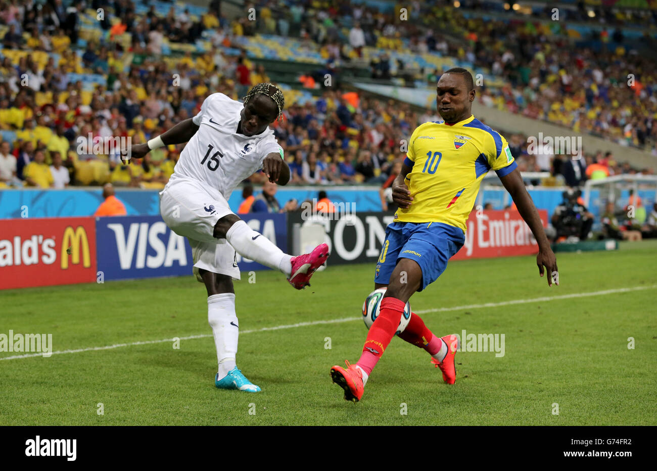Ecuador's Walter Ayovi (right) and France's Bacary Sagna (left) battle for the ball Stock Photo
