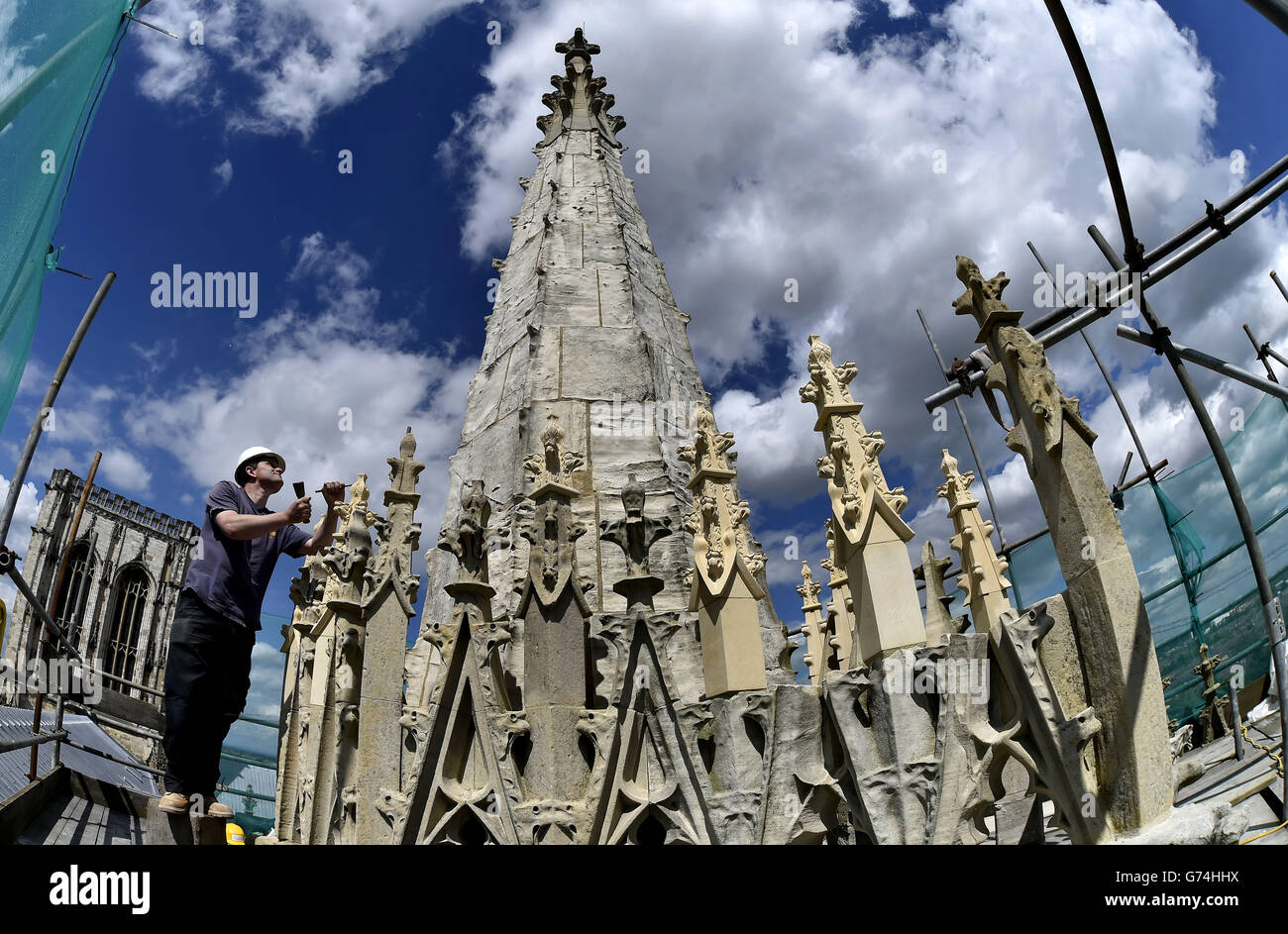 Stone Mason Lindsay Howgarth, 34, works on the final stages of the East Tower at York Minster, the work is Europe's largest conservation project, taking 5 years and costing &pound;20m of which &pound;10.5m has been donated by a lottery grant. Stock Photo