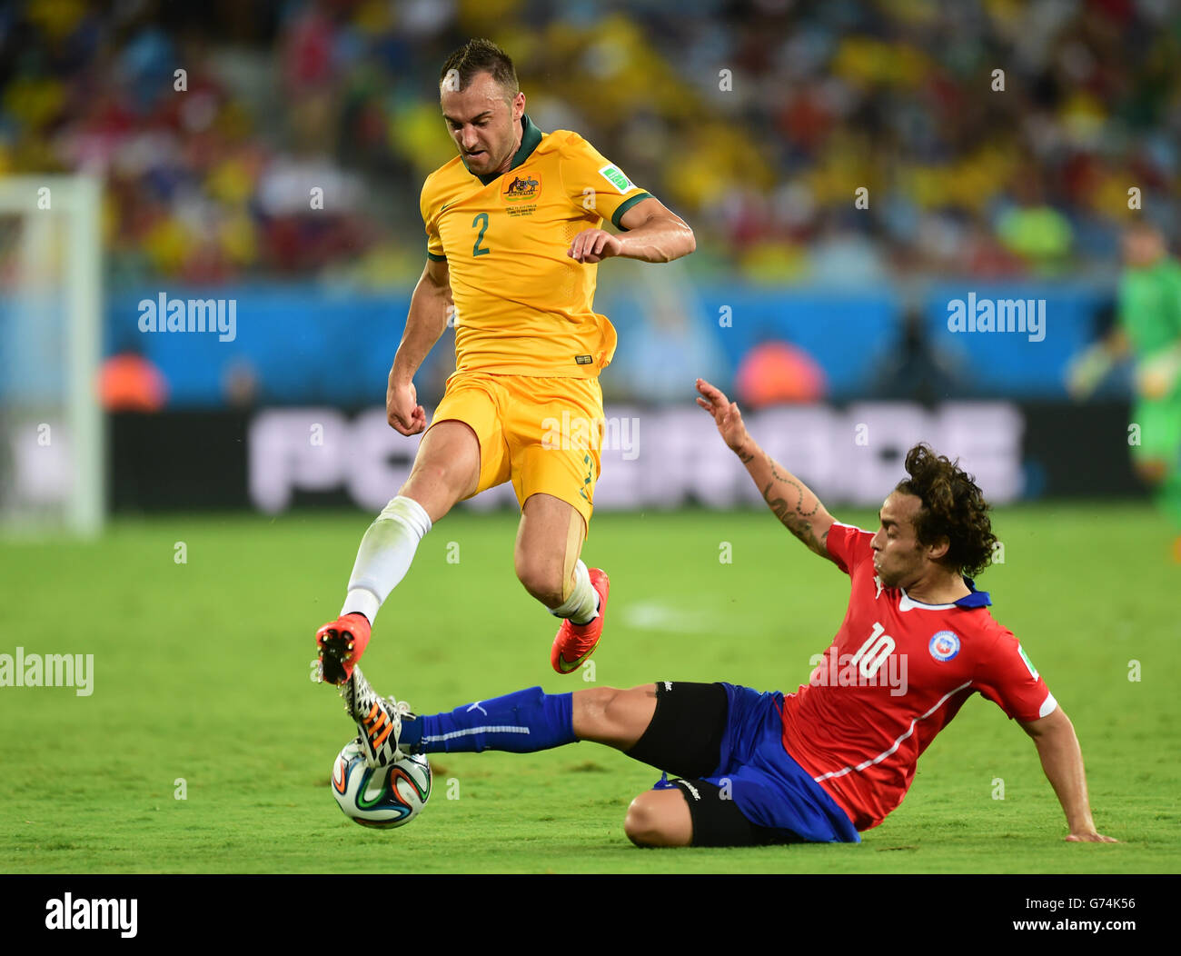 Australia's Ivan Franjic (left) battles for the ball with Chile's Jorge Valdivia Stock Photo