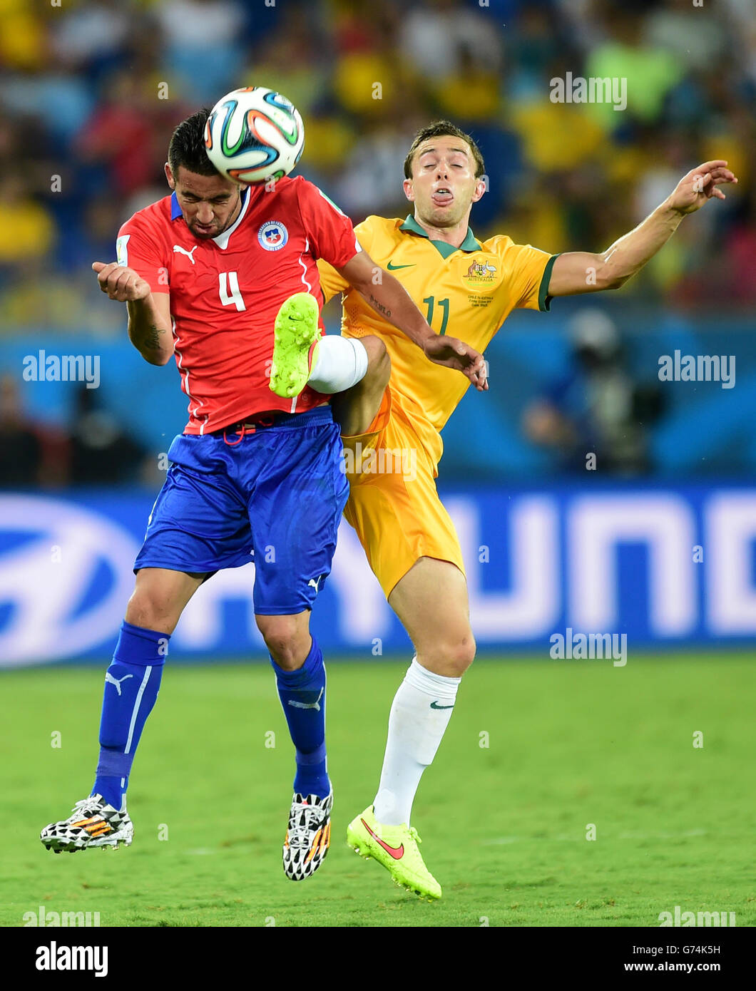 Chile's Mauricio Isla (left) battles for the ball with Australia's Tommy Oar Stock Photo