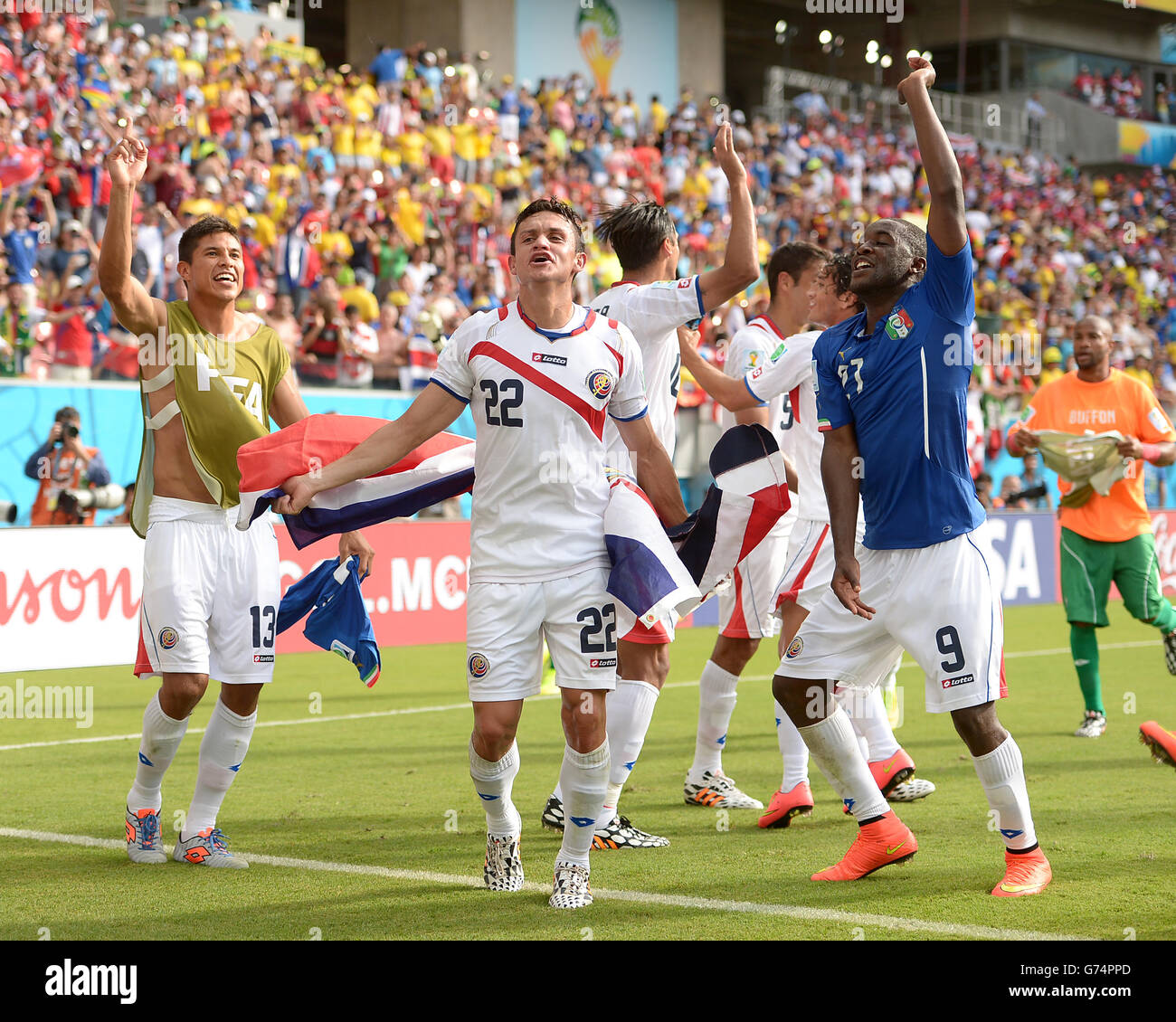 Soccer - FIFA World Cup 2014 - Group D - Italy v Costa Rica - Arena Pernambuco. Costa Rica's Jose Cubero (centre) Joel Campbell (right) and Esteban Granados (left) celebrate after the final whistle Stock Photo